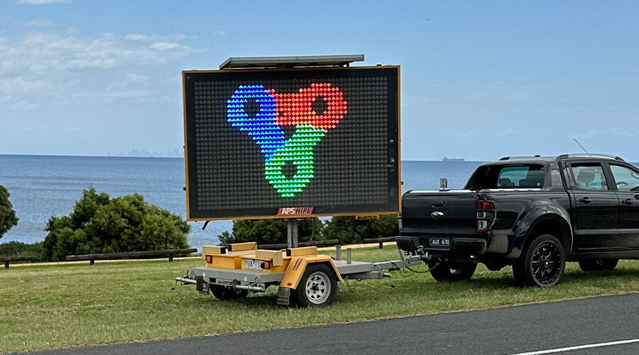 An electronic business advertising sign in Victoria.